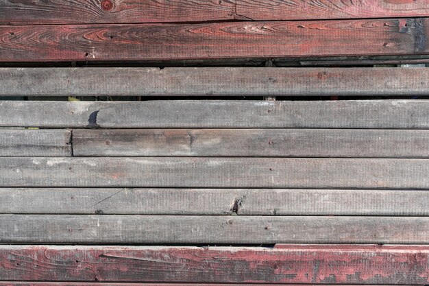 Photo old wooden wall with faded red paint