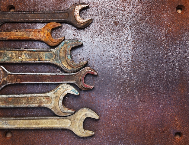 Old wrenches on a metal table