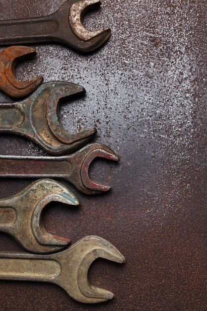 Old wrenches on a metal table