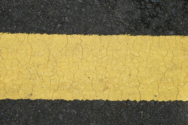 Old yellow line background on the road