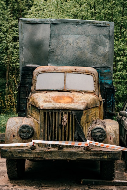 Old yellow retro rusty truck outdoors