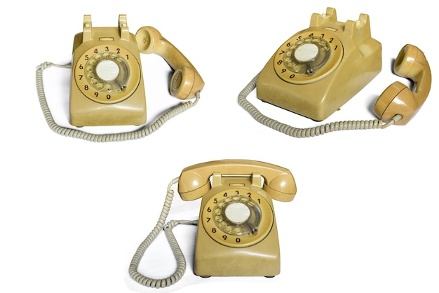 白い背景の古い黄色の電話アンティーク オブジェクトクリッピング パス