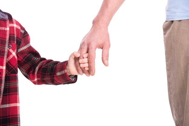 Old and young hands of father and child.