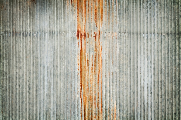 Old zinc wall texture background, rusty on galvanized metal panel sheeting.