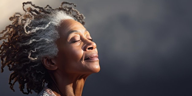 An older mature and friendly elegant woman meditating and doing yoga with calm and serene demeanor