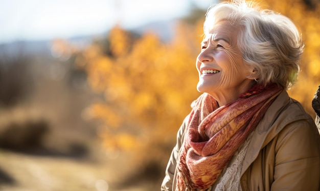 An older woman is smiling while holding a bird