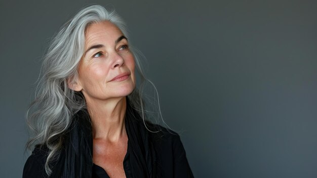 An older woman with gray hair looking up