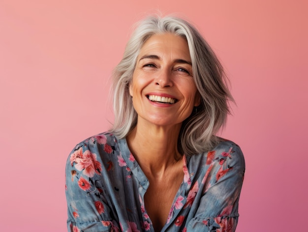 An older woman with gray hair smiling at the camera