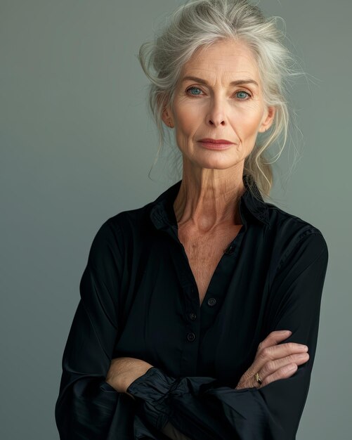 An older woman with white hair and a black shirt