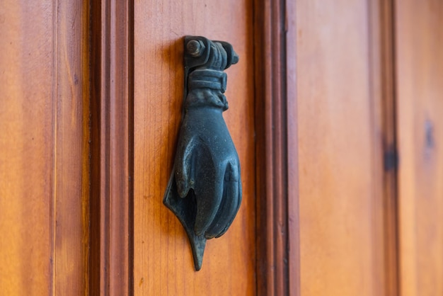 Oldfashioned metal handleDoorknocker on allwood door