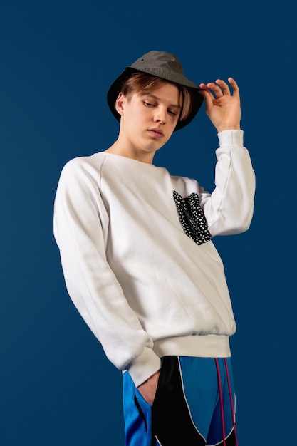 Oldschool fashioned young man dancing isolated on blue background