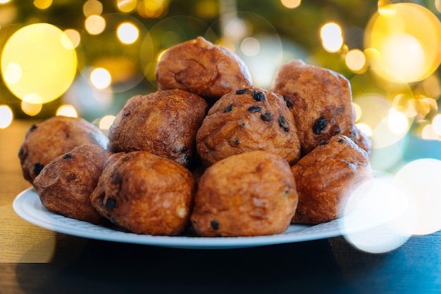 Oliebollen traditional dutch pastry for new years eve with sparkles oil dumpling or fritter with