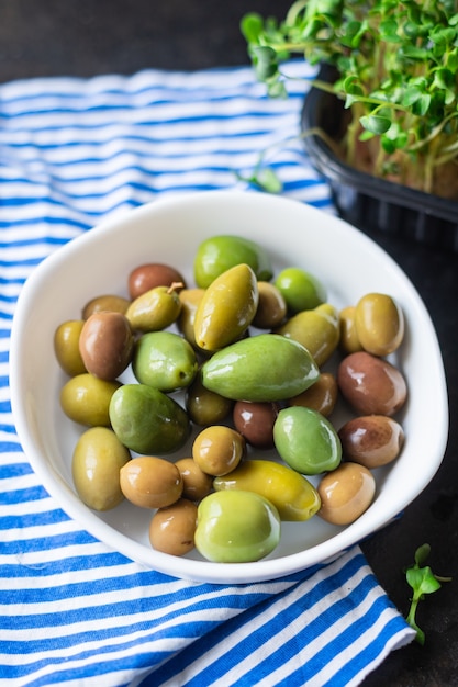 Olive fruit fresh olives pitted in plate on the table veggie