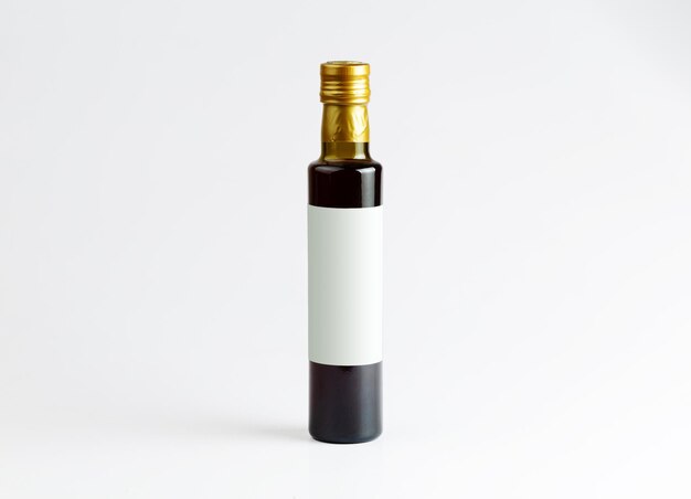 Photo olive oil bottle on white - space for brand and text