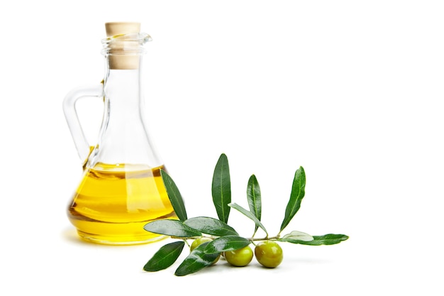 Olive oil and branch with olives on white