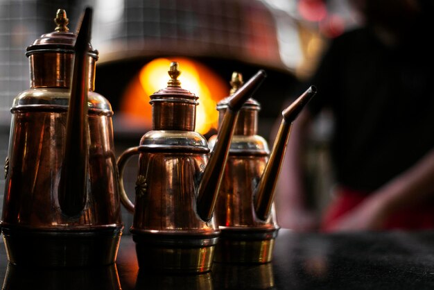 Photo olive oil copper cruet traditional dispenser detail in italian restaurant