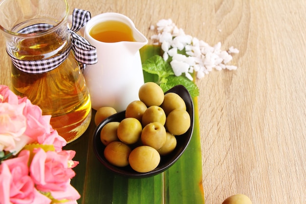 Olive oil for health on wood background