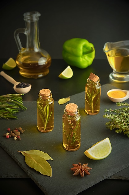 Olive oil, lemon, rosemary, thyme, sweet pepper, peppercorns, lime and bay leaf