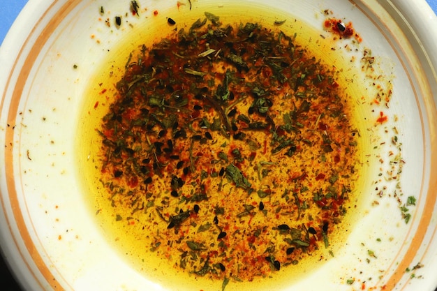 Olive oil and various spices in the plate