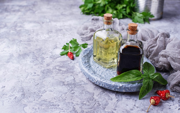 Olive oil and vinegar in glass bottles. Selective focus