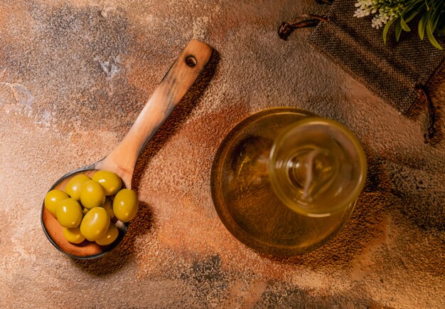 Olive oil on wooden table
