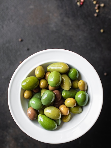 olive pitted plate on the table varieties fruits vegan vegetarian food