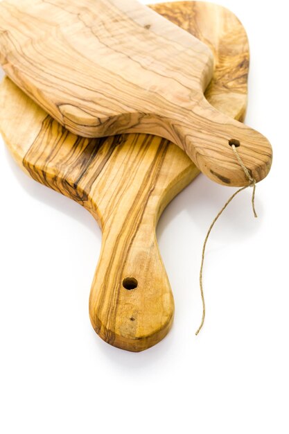 Olive wood cutting board on a white background.