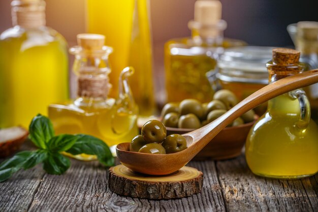 Olives and bottles of extra virgin olive oil