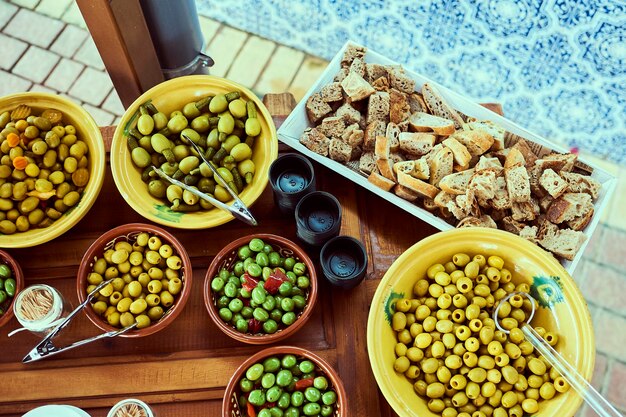 Olives and croutons on table