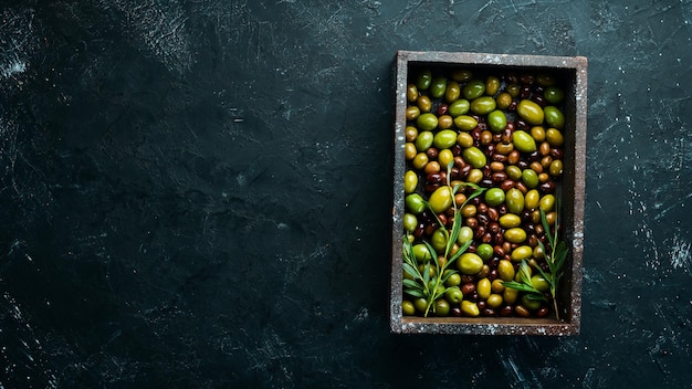 Olives in a wooden box Top view Free space for your text