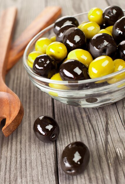 Olives on a wooden table ...