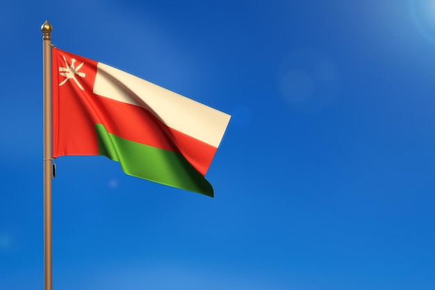 Oman Flag blown by the wind with blue sky in the background