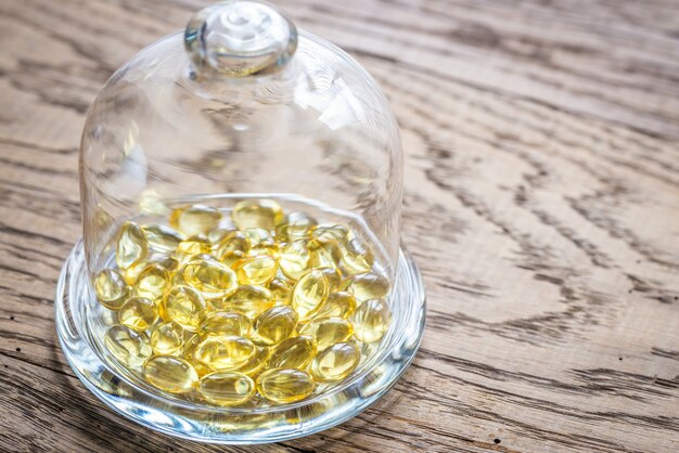 Omega-3 capsules under the glass dome