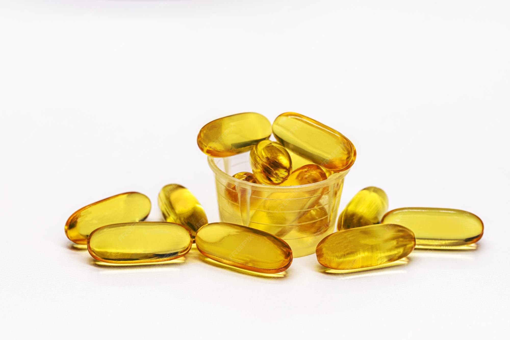 Premium Photo Omega 3 capsules or tablets in dose meter isolated