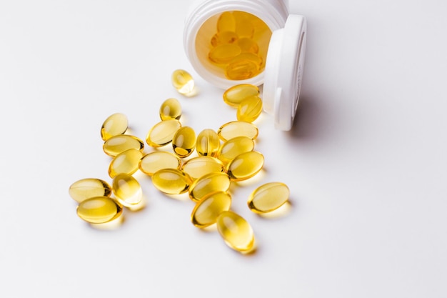 Omega 3 fish oil capsules isolated on white background