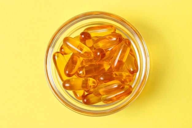 Omega capsules on a colored background fish oil healthy supplements