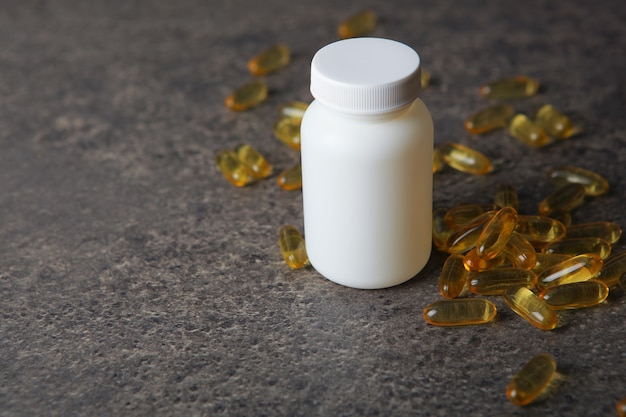 Omega  capsules on the table closeup with place for text