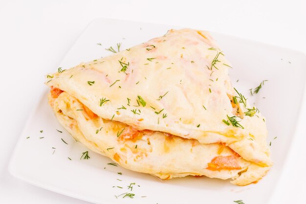 Omelet eggs with ham and vegetables