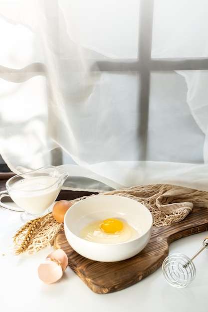 omelet making process ingredients eggs and milk on the table