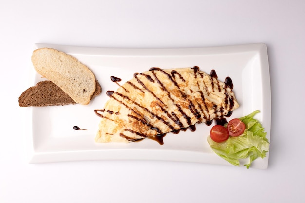 Omelet omelet with vegetables food on a white background isolated