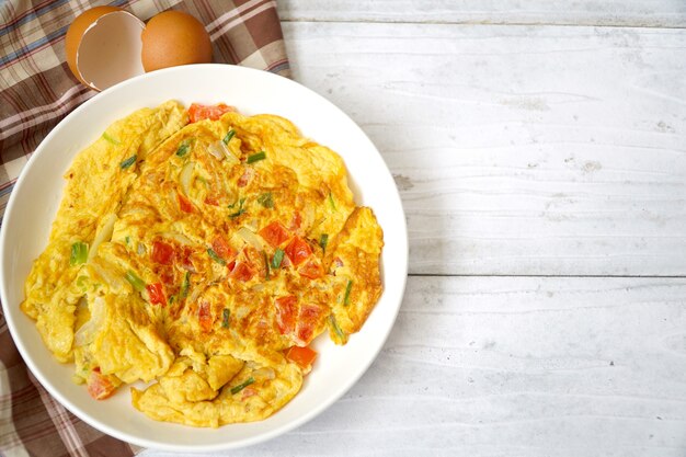 Omelet (Omelette,Scrambled) on white wood background