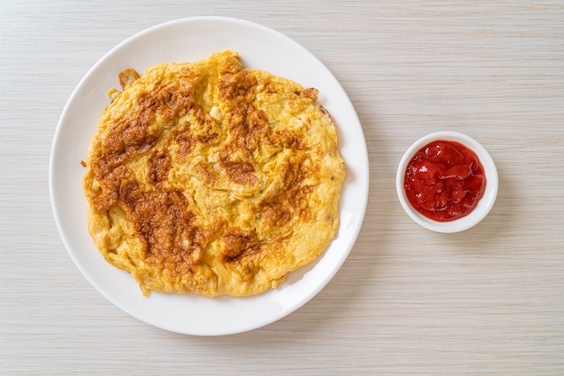 Omelet or Omelette with Ketchup