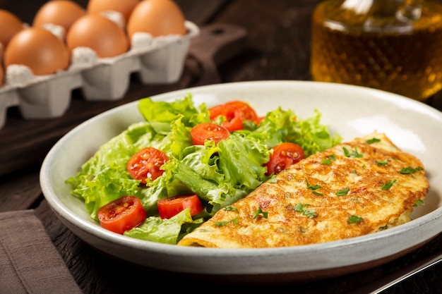 Omelet with cheese and lettuce and tomato salad