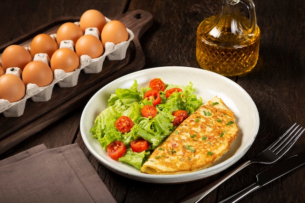 Omelet with cheese and lettuce and tomato salad