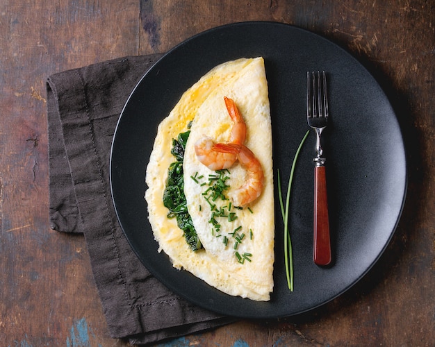 Omelet with spinach and shrimps