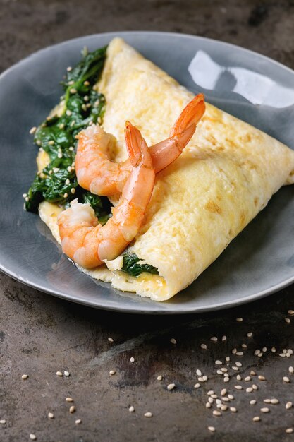 Omelet with spinach and shrimps