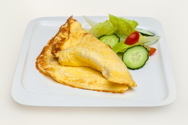 Omelet with vegetables isolated on white Top view