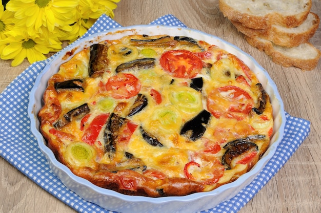 Omelette eggplant, leek, tomatoes and pepper with cheese