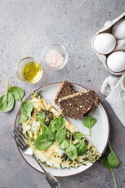 Omelette stuffed with spinach and cheese for healthy breakfast, top view