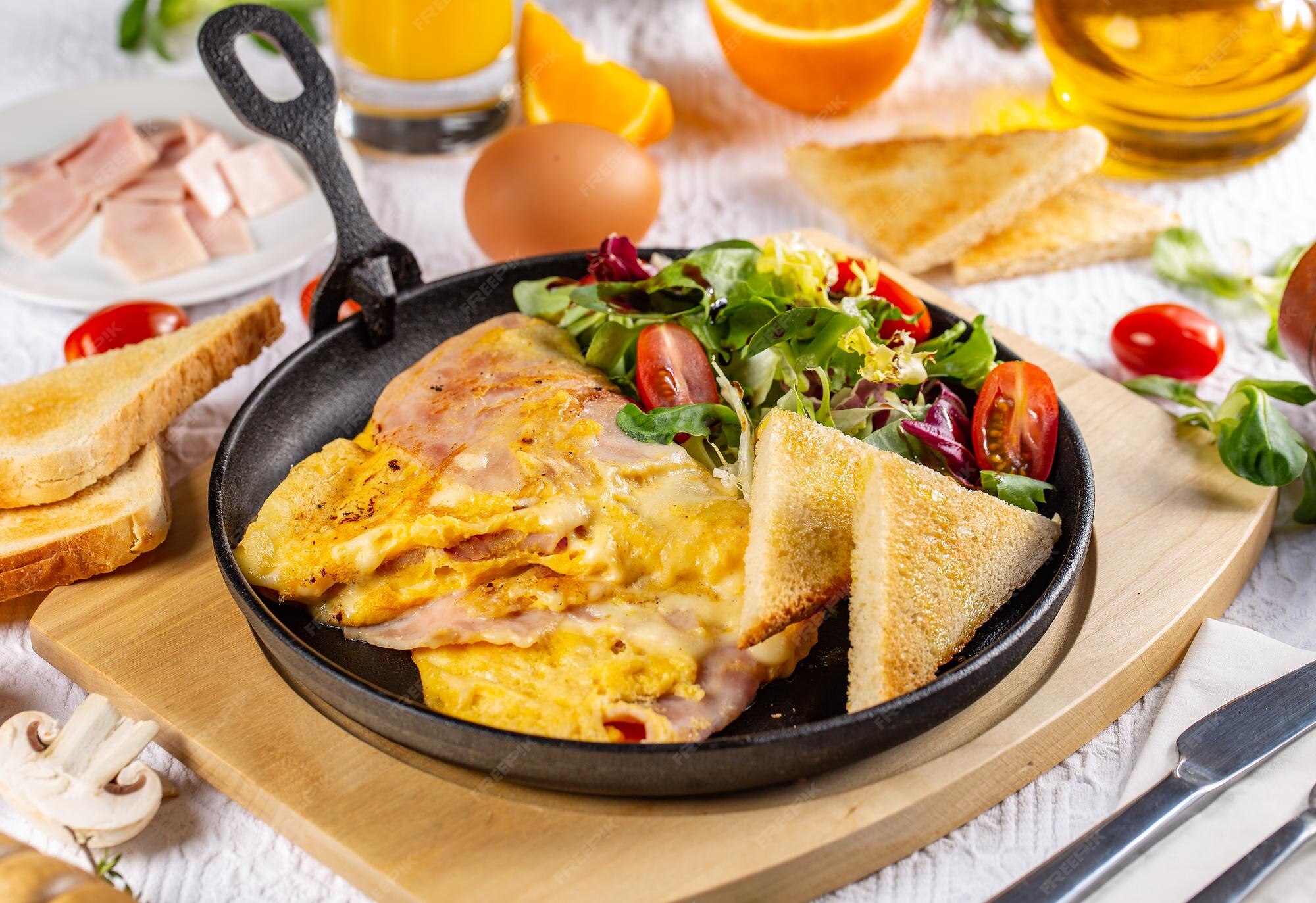 Premium Photo | Omelette with ham and cheese